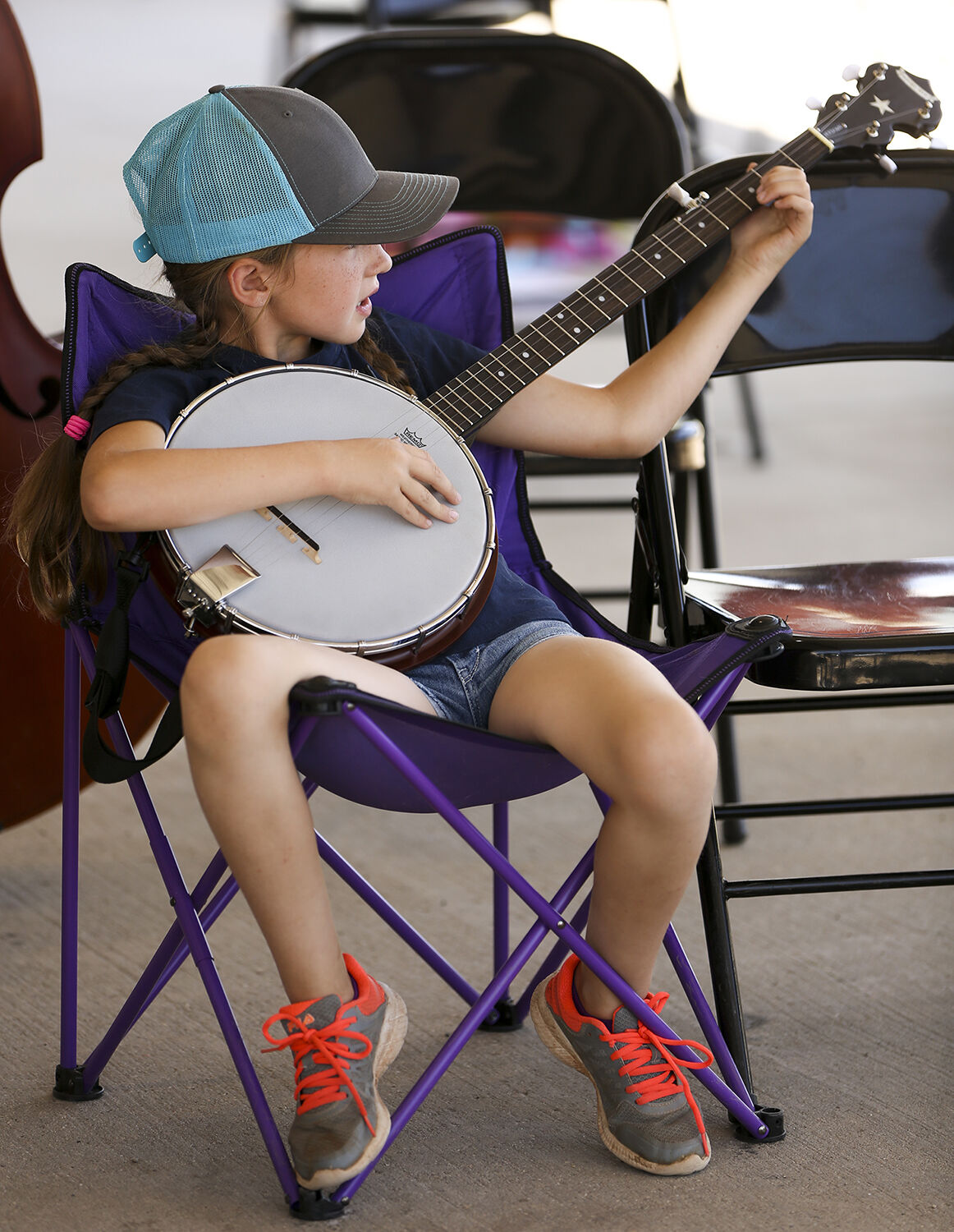 Emory Forbes, 8, joins the silly song group on her banjo